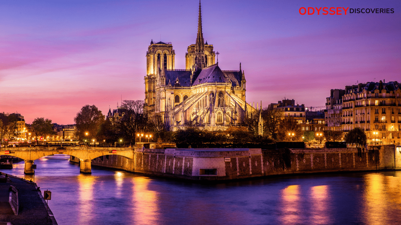 A breathtaking view of Notre Dame Cathedral in Paris, France, with its iconic towers and intricate Gothic architecture against a bright blue sky.